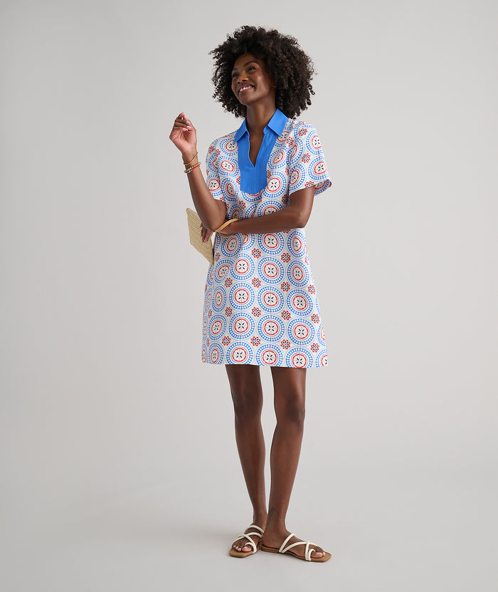 Model are wearing UNTUCKit Paola dress in printed tile blue.