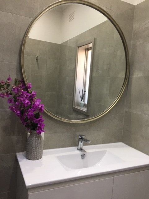 Looking Glass Mirror in Silver in a room