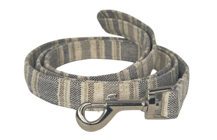 Striped dog leash with metal clip on a white background