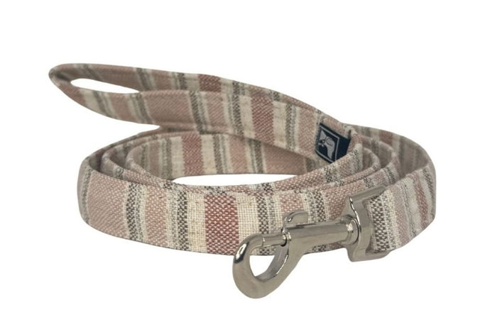 Striped dog leash with a metal clip on a white background