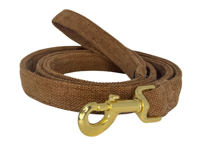 Brown dog leash with a gold clasp on a white background