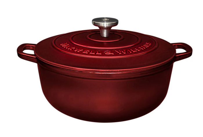 Red cast iron cookware with 'Maxwell & Williams' branding on a white background