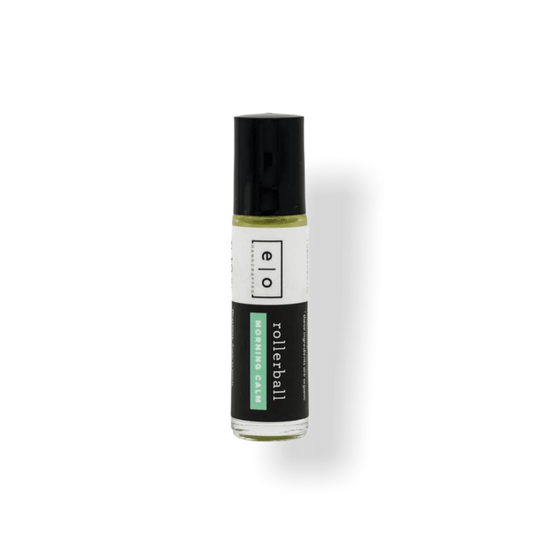 Small clear glass rollerball bottle with black cap containing a light yellow liquid labeled Morning Calm Rollerball - Anxiety Support | Essence One, designed for wellness and skincare.