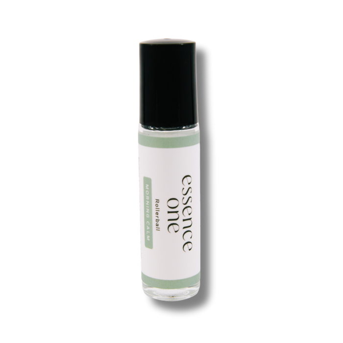 Clear glass rollerball bottle with a black cap labeled Morning Calm Rollerball - Anxiety Support | Essence One, designed for wellness and body care use.