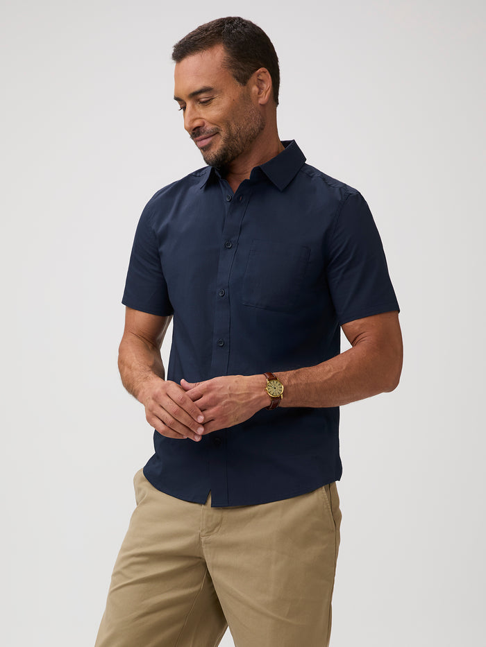 navy short sleeve shirt and khaki pants | Classic blue shirts. Rebuilt so it can finally keep up with your day.