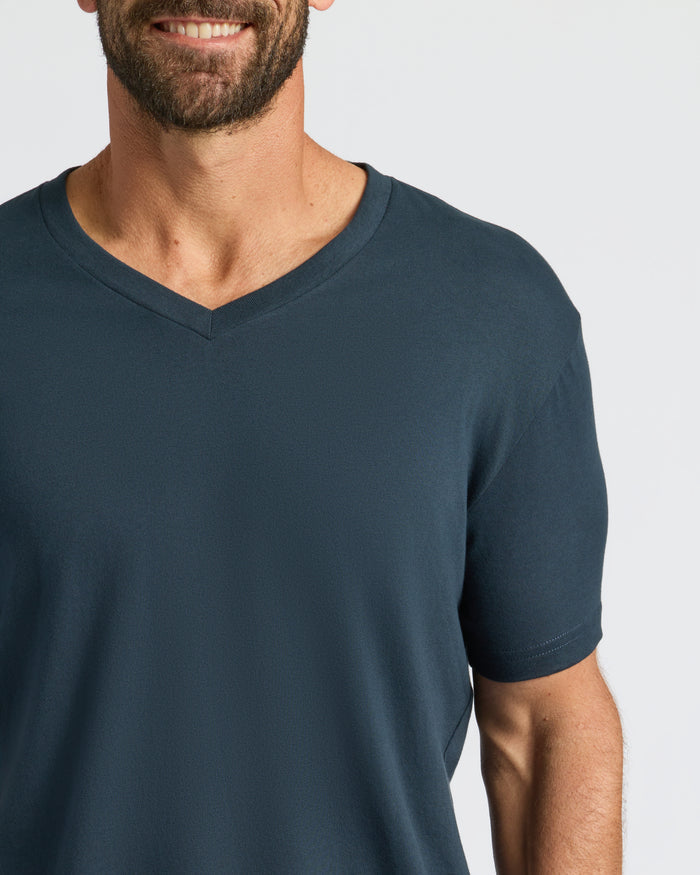 Man wearing Classic V-Neck T-shirt, smiling, beard visible.