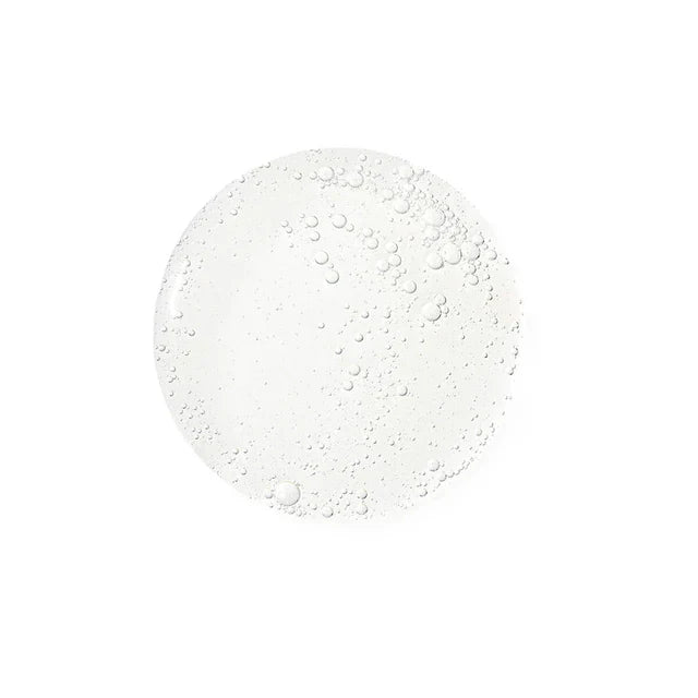 White circular object with water droplets on a white background
