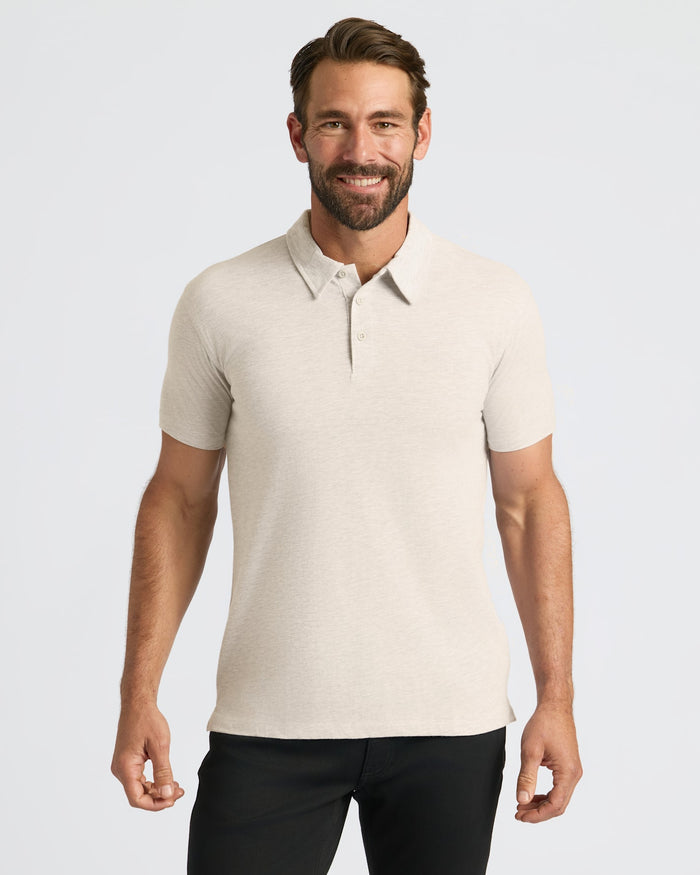 Man wearing Oatmeal Classic Polo with a three-button placket, smiling.