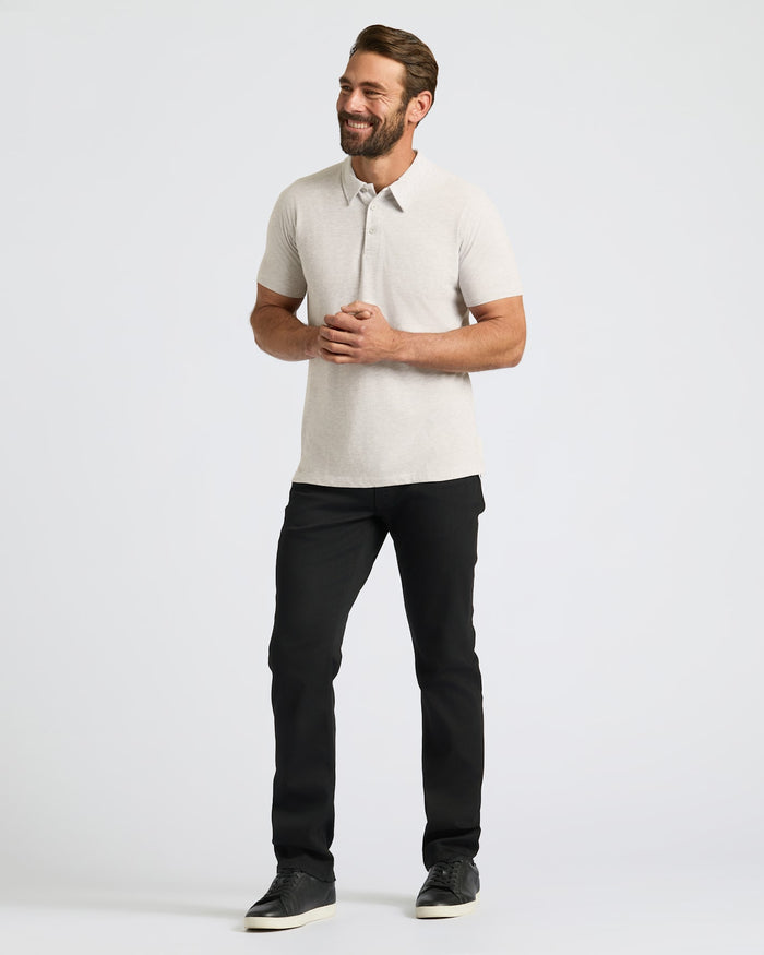 Man wearing Seasonal Classic Polo 3-Pack in light beige with black pants.