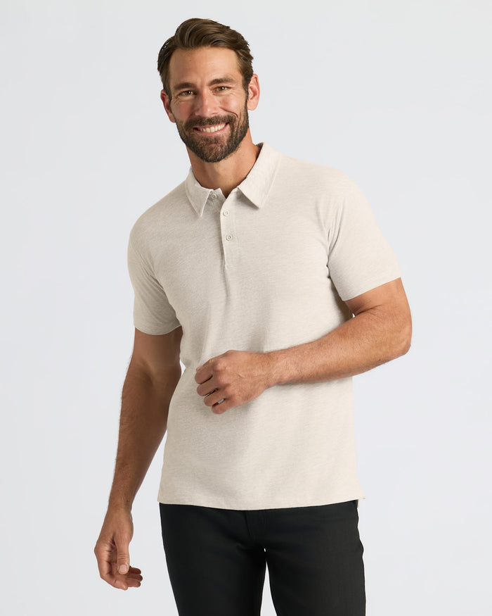 Man wearing Seasonal Classic Polo 3-Pack, light-beige polo, dark trousers.