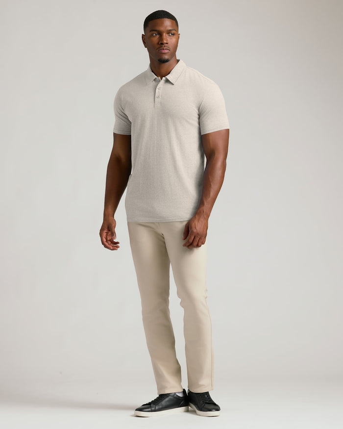 Seasonal Tall Classic Polo 3-Pack modeled by a man in beige.