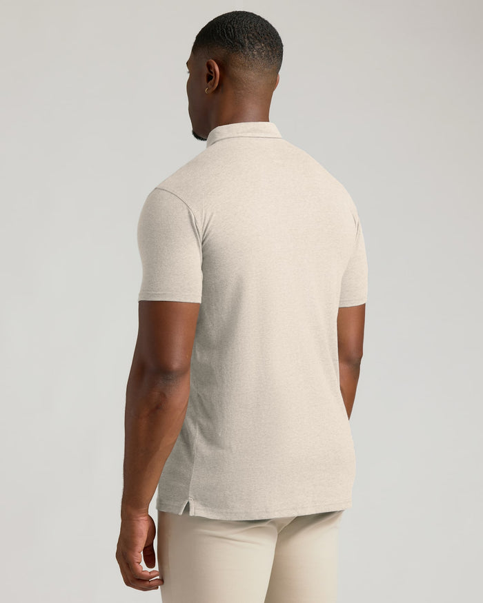Man wearing Oatmeal Short Sleeve Tall Polo, back view.