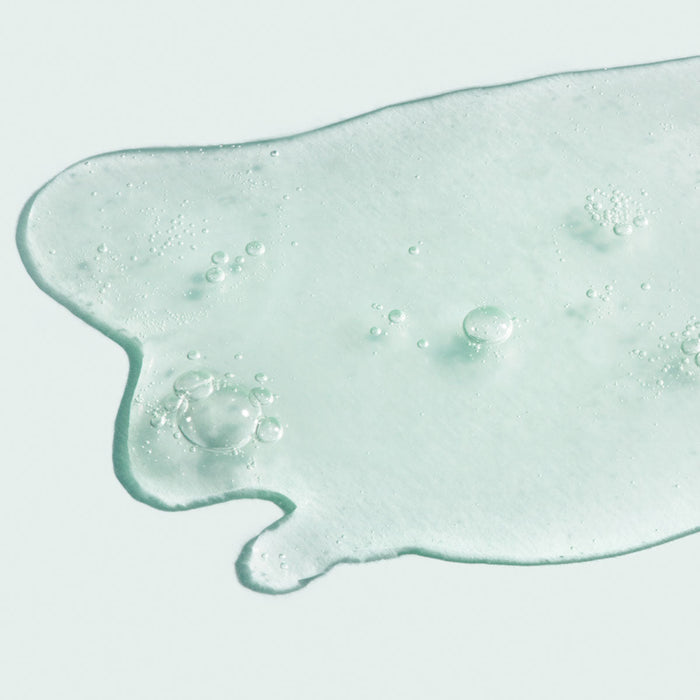 Clear gel texture with small air bubbles representing the lightweight consistency of ORMEDIC balancing antioxidant serum | IMAGE Skincare for skincare and wellness.