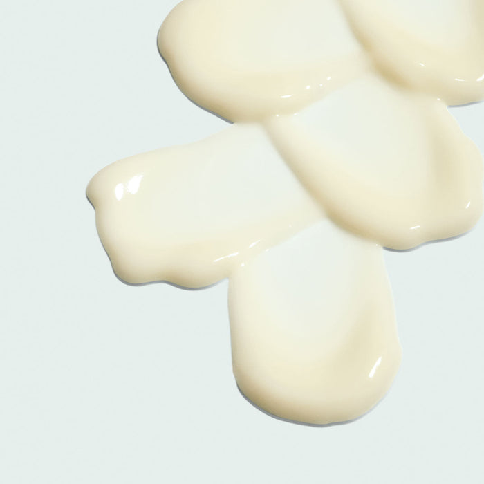 Creamy beige texture of ORMEDIC balancing eye lift gel | IMAGE Skincare displayed on a light background, highlighting its smooth skincare consistency.