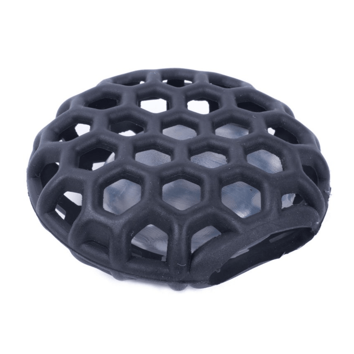 Close up of a black hexagon cage with plastic squeaker inside.