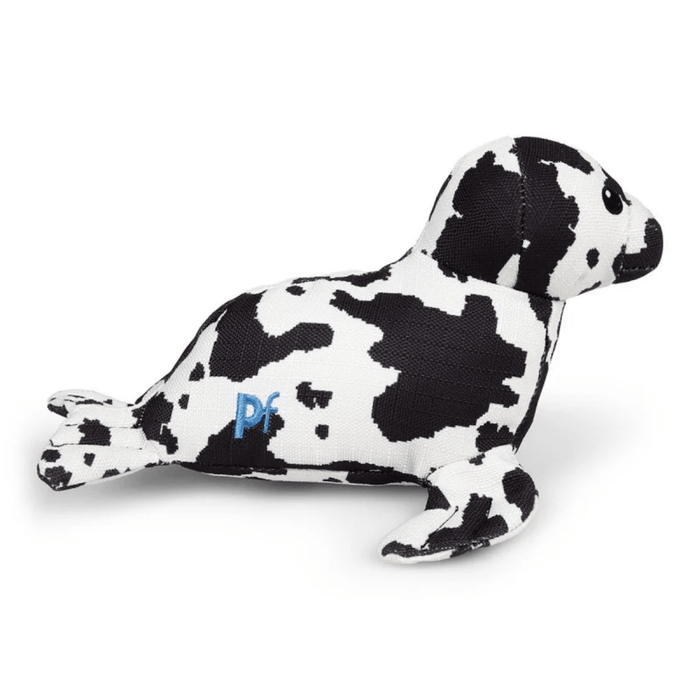 Side view of black and white seal plush dog toy with stitch detail with text 'PF' on side on a white back ground.