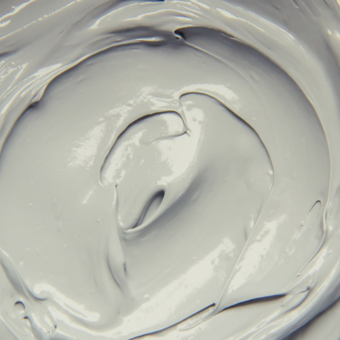 Close-up of smooth, creamy light gray Phyto Clay Masque | Privai, showcasing its rich texture ideal for deep skincare treatments and revitalizing the skin.