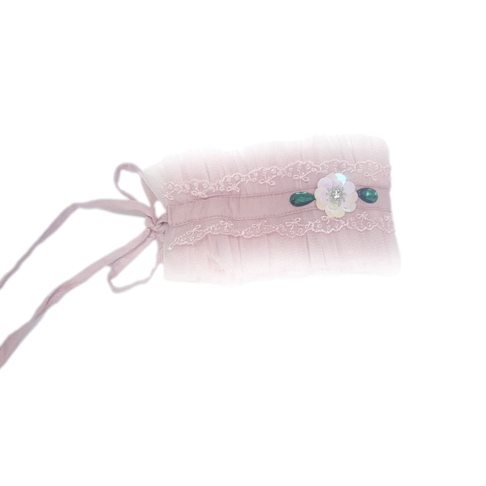 Pink ballerina hair sash featuring soft pleated fabric, lace trim, and decorative jewel accents, styled with a delicate tie back ribbon