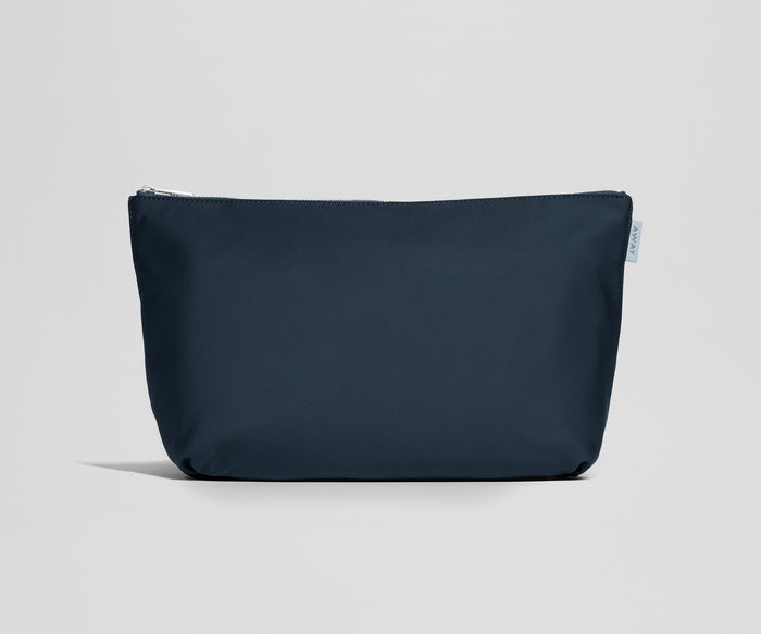 Navy blue pouch with a zipper on a light gray background