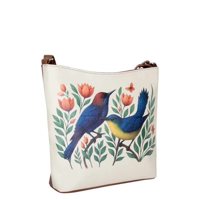 Women's handpainted birds crossbody bag in vegan leather for everyday use, work, office, travel, shopping, trips, and gifting-half side view