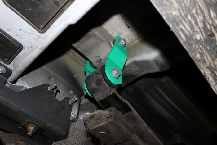 REAR 1/2 Lift Shackle - Transit (2015+ Single Rear Wheel) by Van Compass, shown close-up with visible screws and metal arm for easy bolt-on rear height increase.