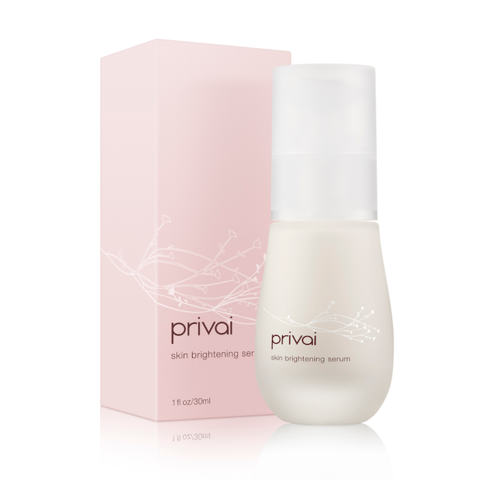 Bottle and box of Skin Brightening Serum | Privai with delicate floral design on a white background, highlighting skincare and wellness care.