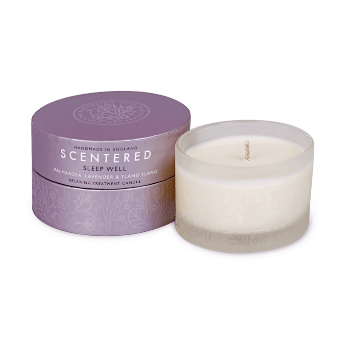 Sleep Well Aromatherapy Candle | Scentered in a frosted glass container next to its purple cylindrical box, designed for relaxation with notes of palmarosa, lavender, and ylang ylang.