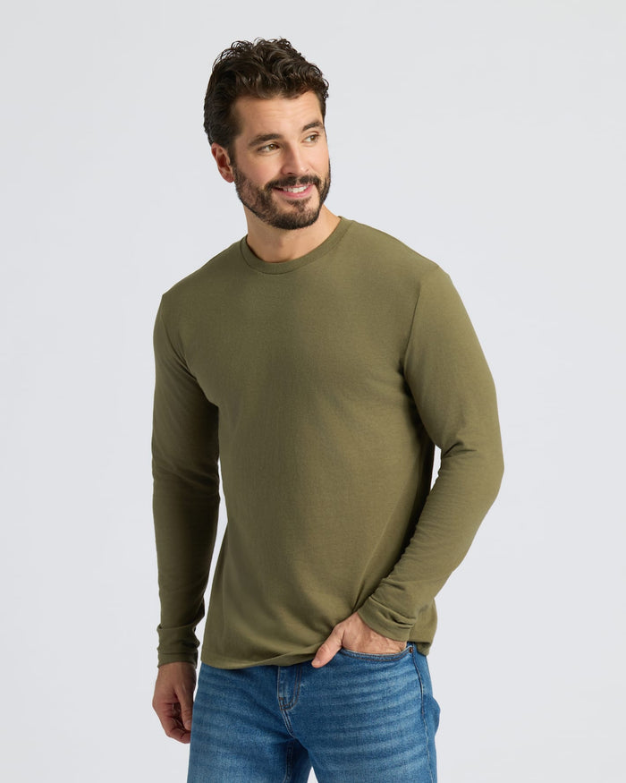 Man wearing Staple Classic Long Sleeve Crew Neck in olive green.