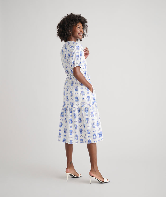Model is wearing UNTUCKit Brigitte dress in floral white print.