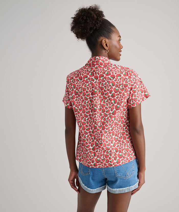 Model is wearing UNTUCKit Jamie shirt in strawberry print.