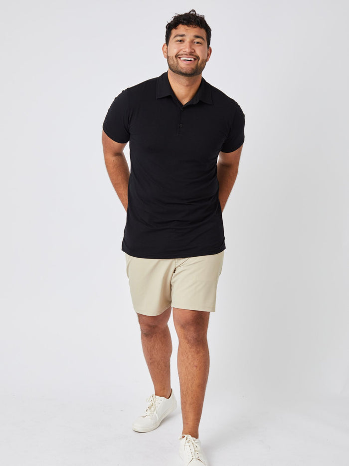 Matheus is 6', 210LBS and wears a size XL # Men's Black Performance Polo | Designed to move, made to fit just right
