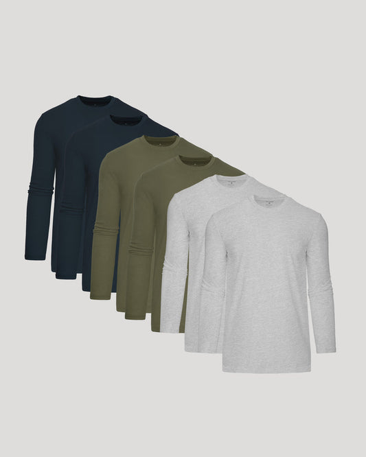 Four long-sleeve shirts in navy, green, and gray on a light gray background
