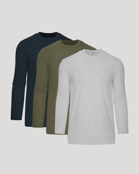 Three long-sleeve shirts in navy, green, and gray on a light gray background