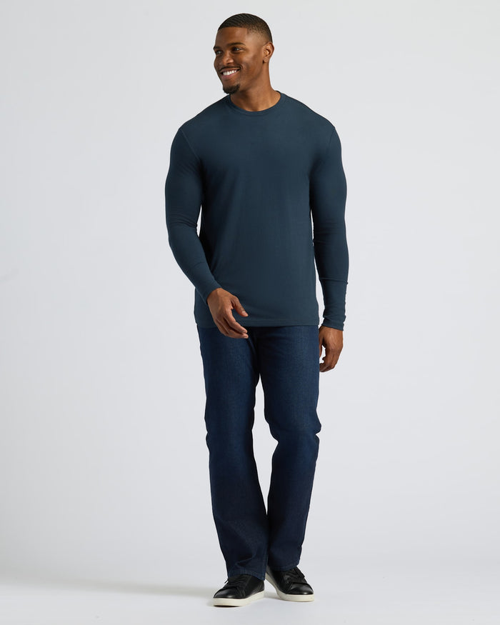 Male model in Navy Tall Long Sleeve T-Shirt and jeans.