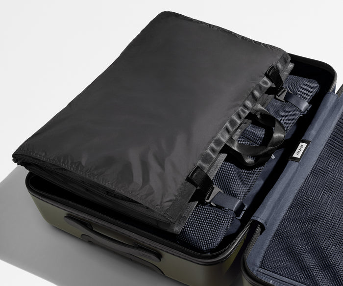 Folded Garment Sleeve clipped inside a checked suitcase // Shown inside The Large