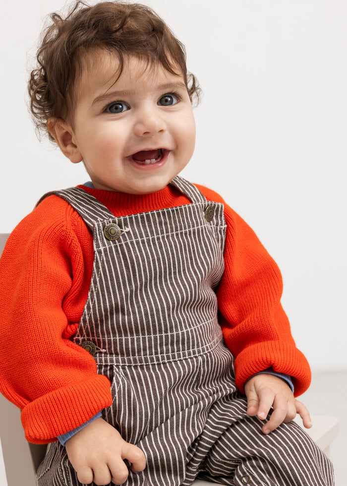 Torin B orange striped blouse with ribbed edges on the sleeves and a round neckline.