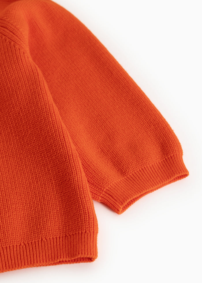 Torin B orange blouse in orange with ribbed edge at the sleeve ending and seams.