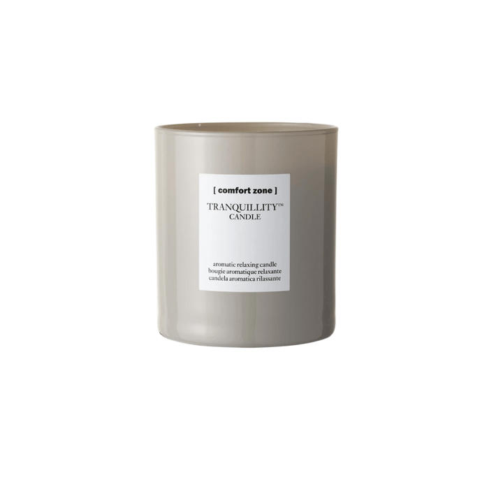 Minimalist ceramic candle in neutral taupe with white label, featuring the Tranquillity Candle | [ comfort zone ] for a calming and aromatic wellness experience.