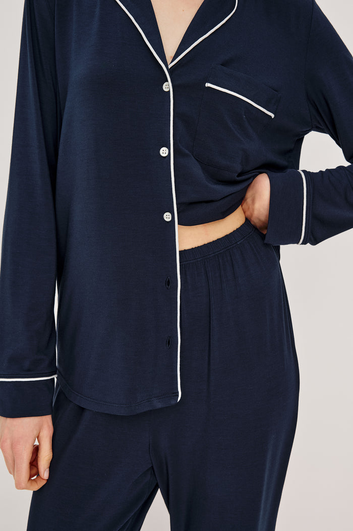 Varra Pajama Set in Jersey With Contrast Piping Button-Up Shirt With Notched Collar and Long Sleeves and Matching High-Waisted Pants With Adjustable Waist Drawstring Ties in Loose Fit in Navy Colorway - Full Body Front View Featured on Model