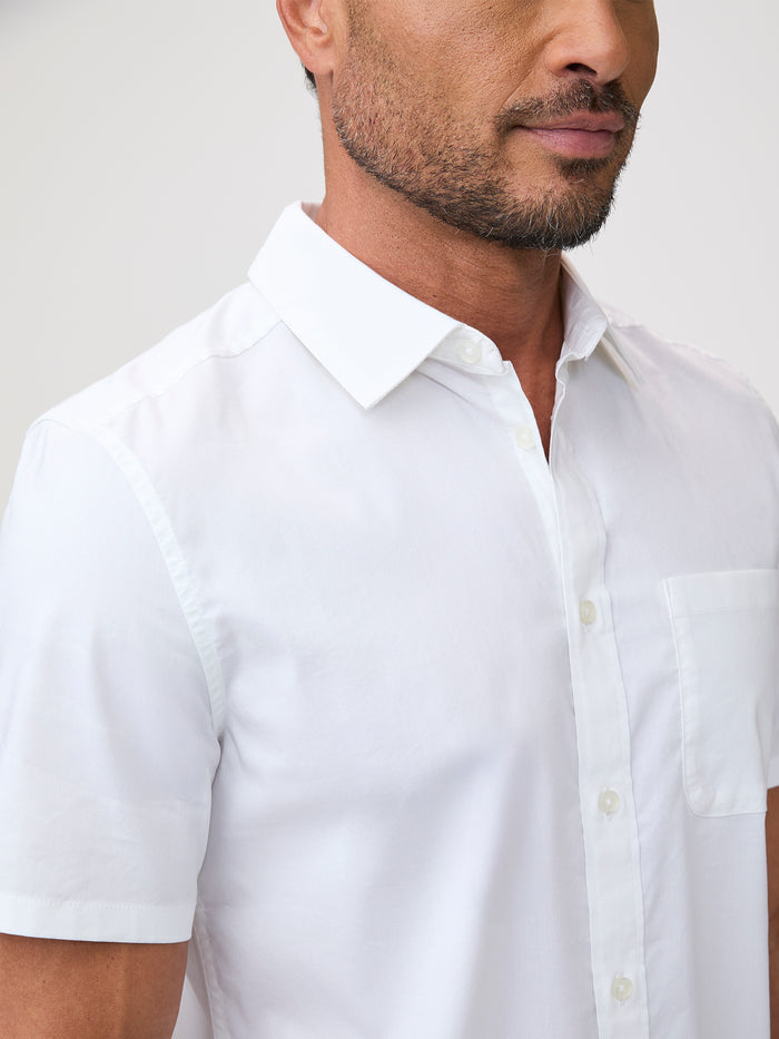 Man wearing a white short-sleeve shirt  | breathable button up shirts