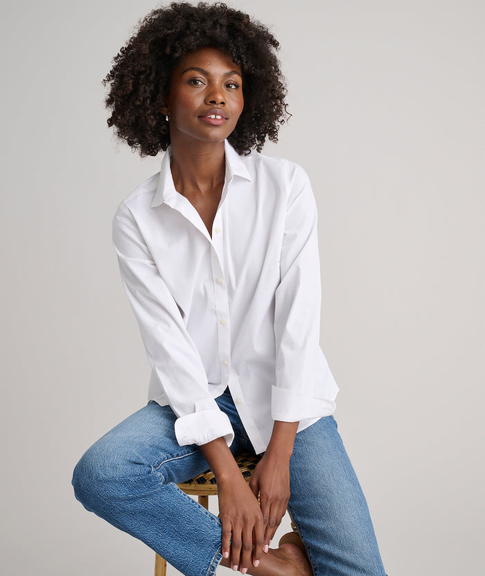 Model is wearing UNTUCKit Bella shirt in white.