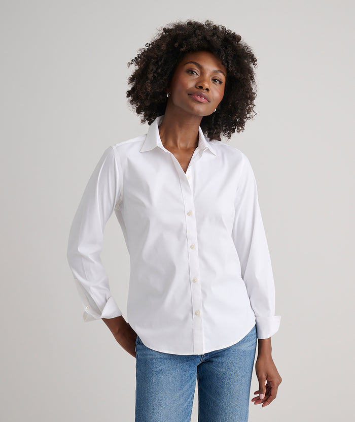 Model is wearing UNTUCKit Bella shirt in white.